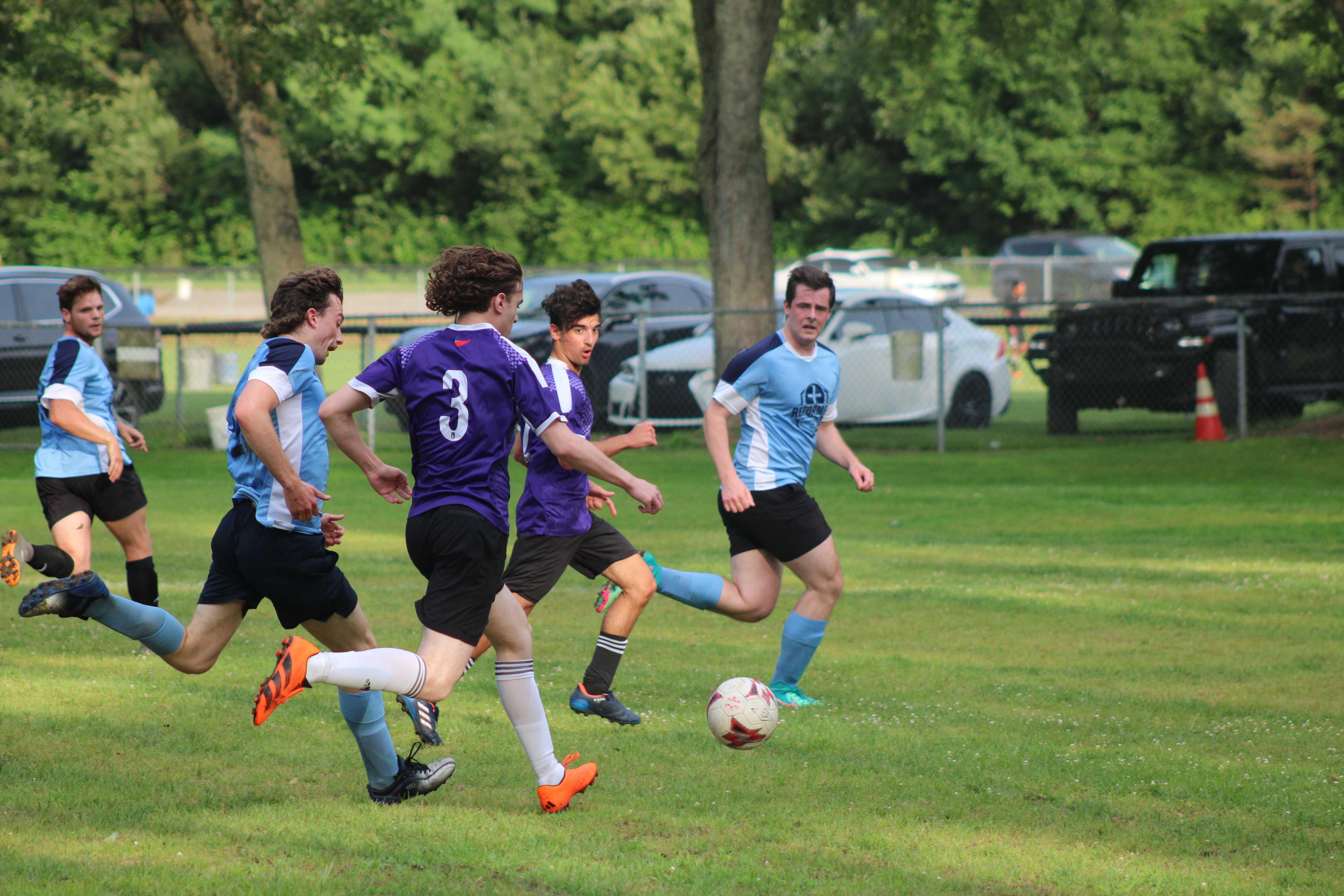 Match action - Curinga FC vs opponent in purple