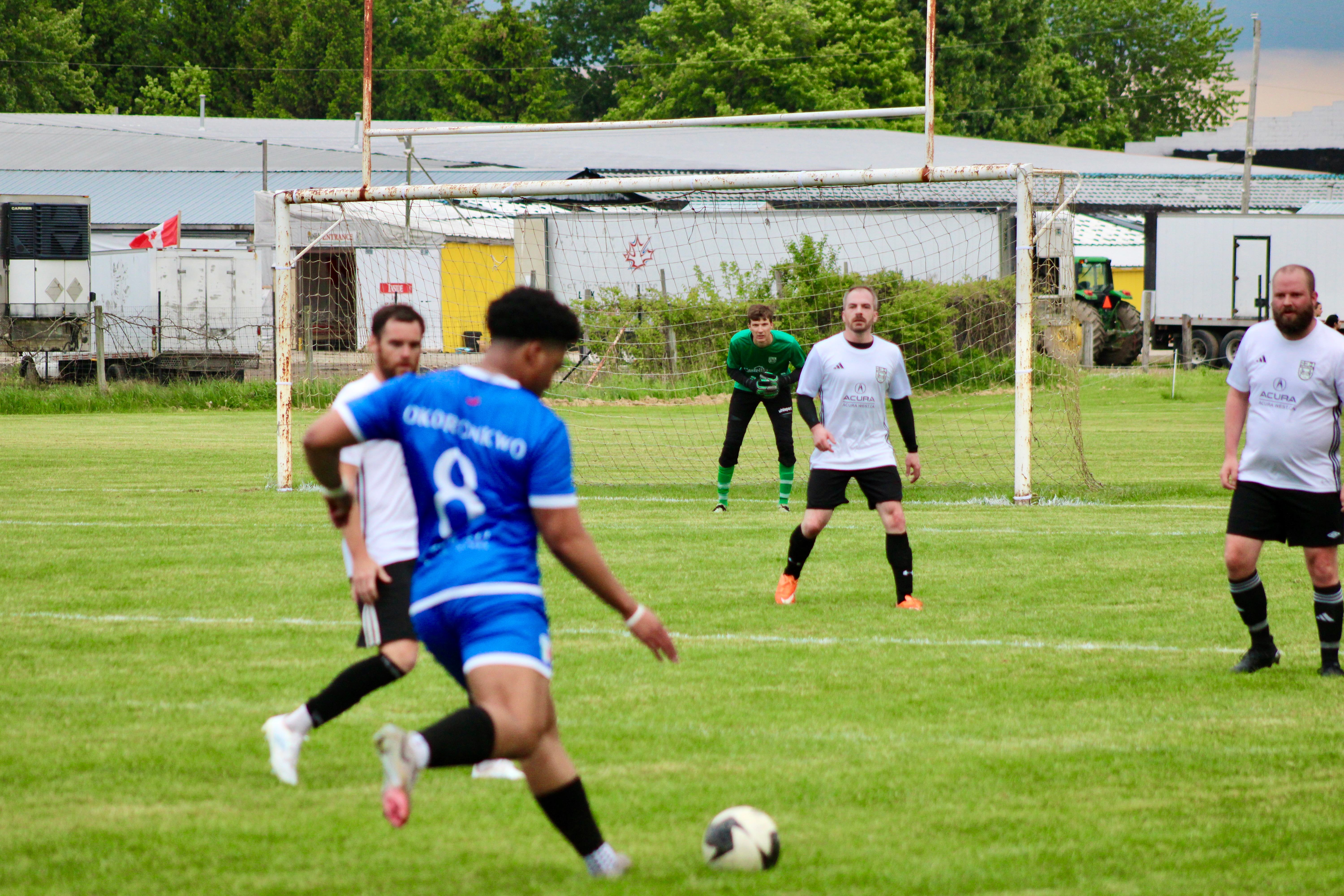 Okoronkwo (#8) approaching goal area during Curinga FC outdoor match