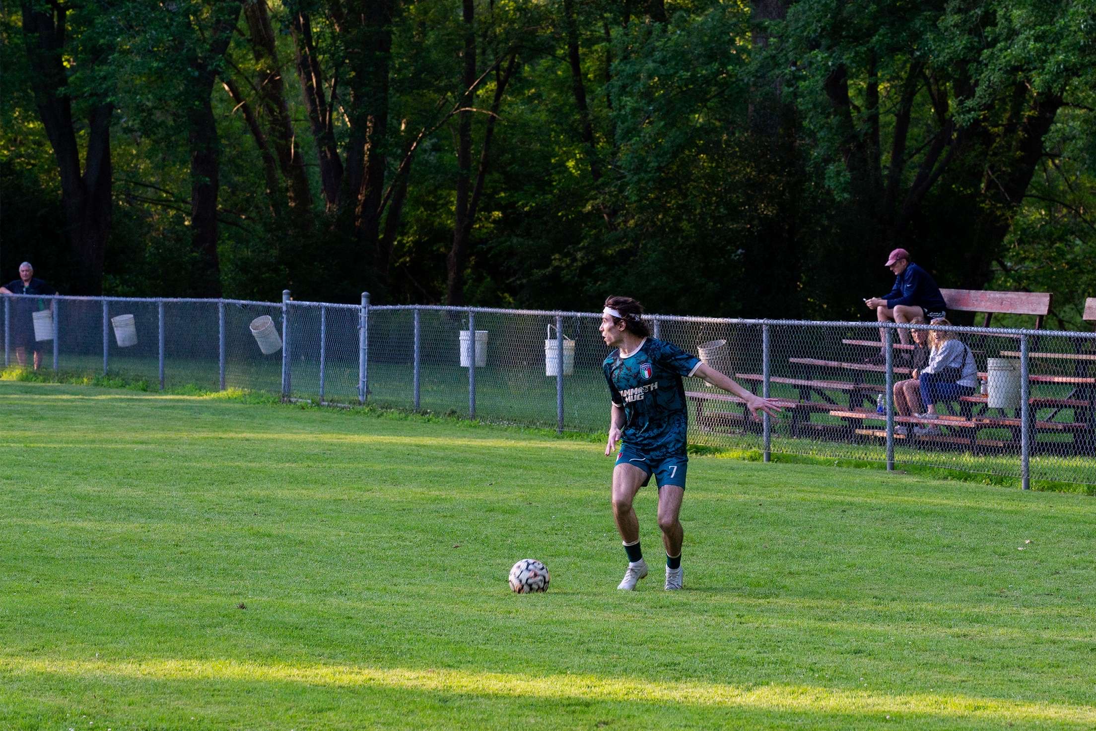 Curinga FC player controlling the ball on the field