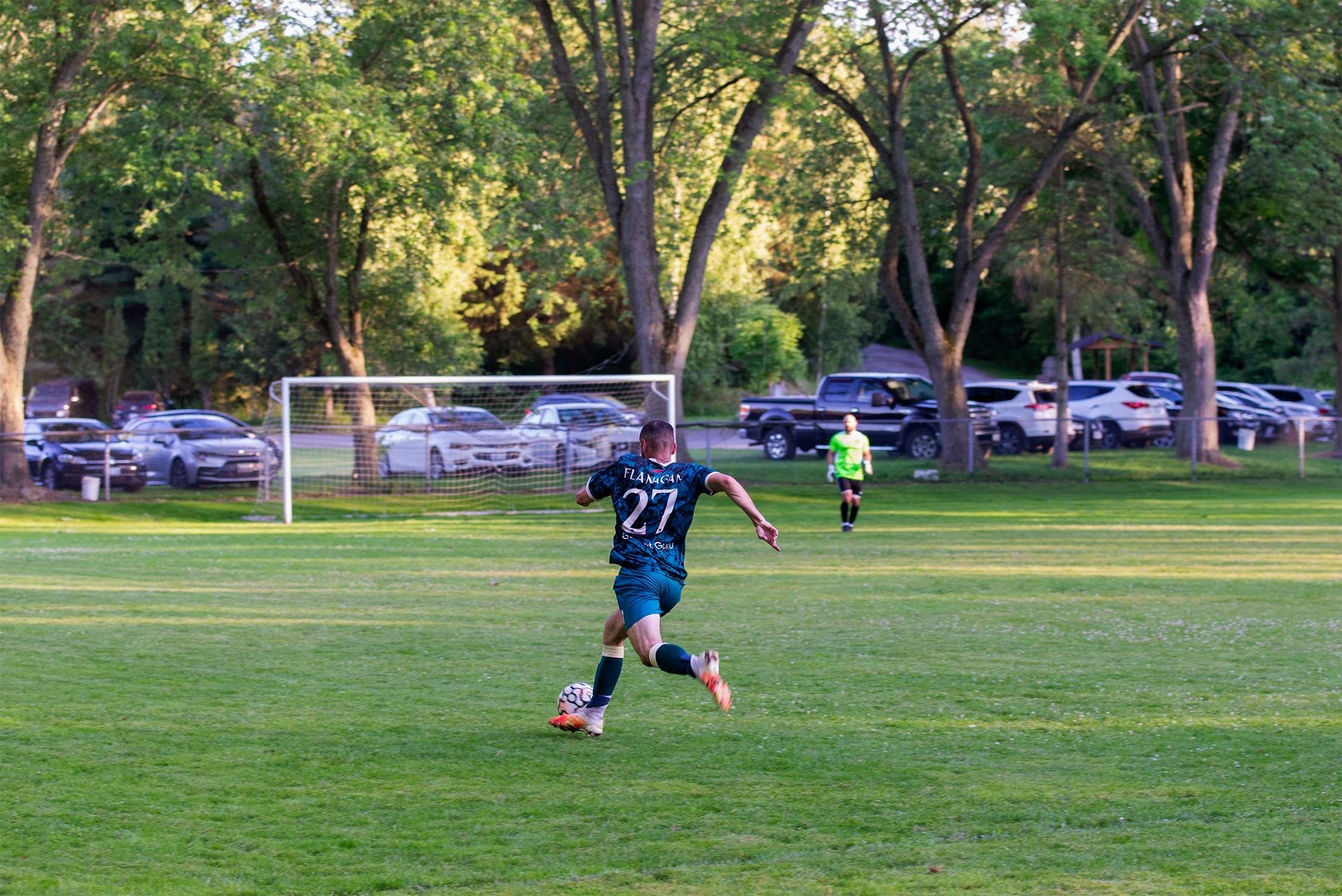 Flanagan (#27) advancing with the ball for Curinga FC