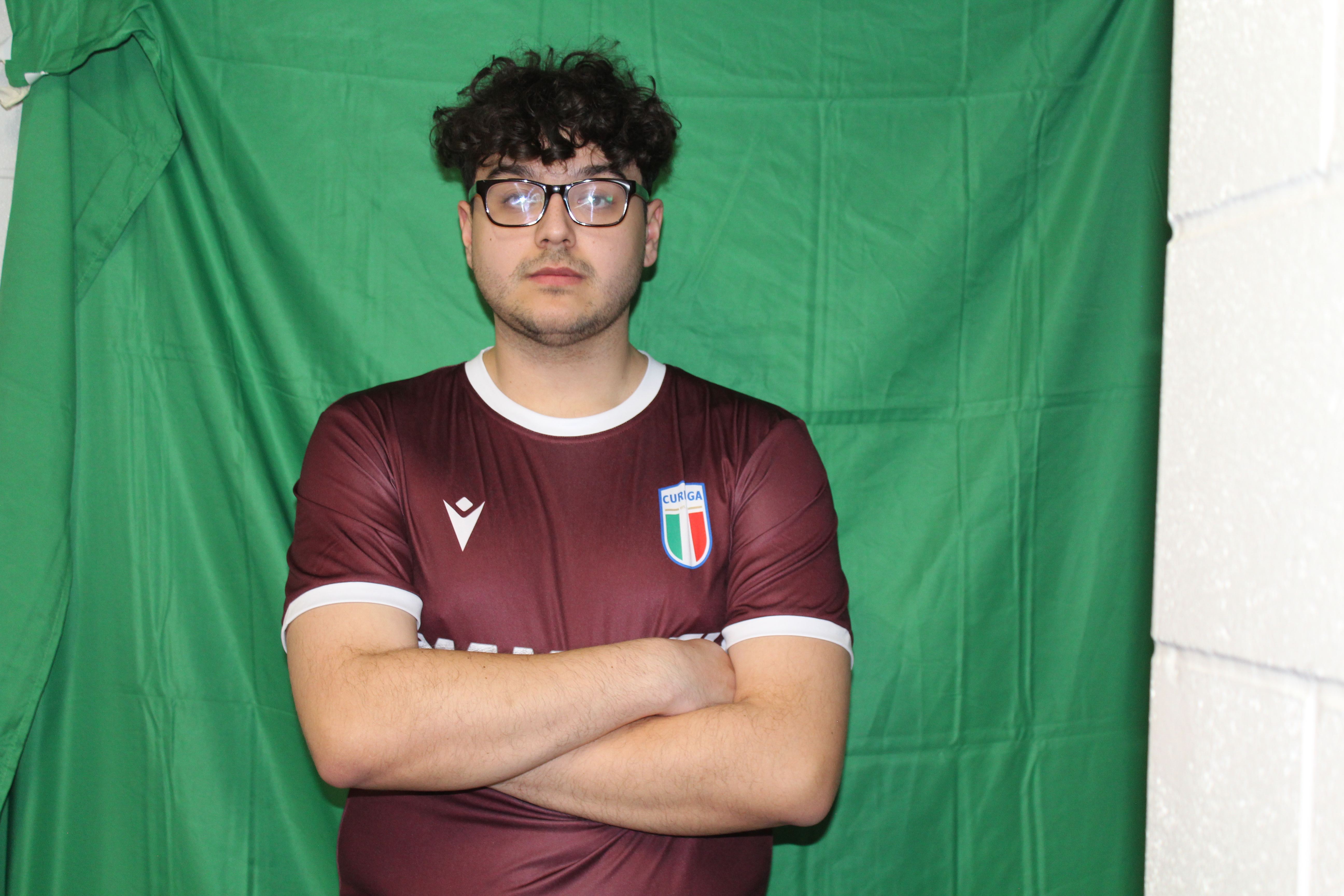 Buringa FC player in maroon jersey with Mammoth Mug sponsor