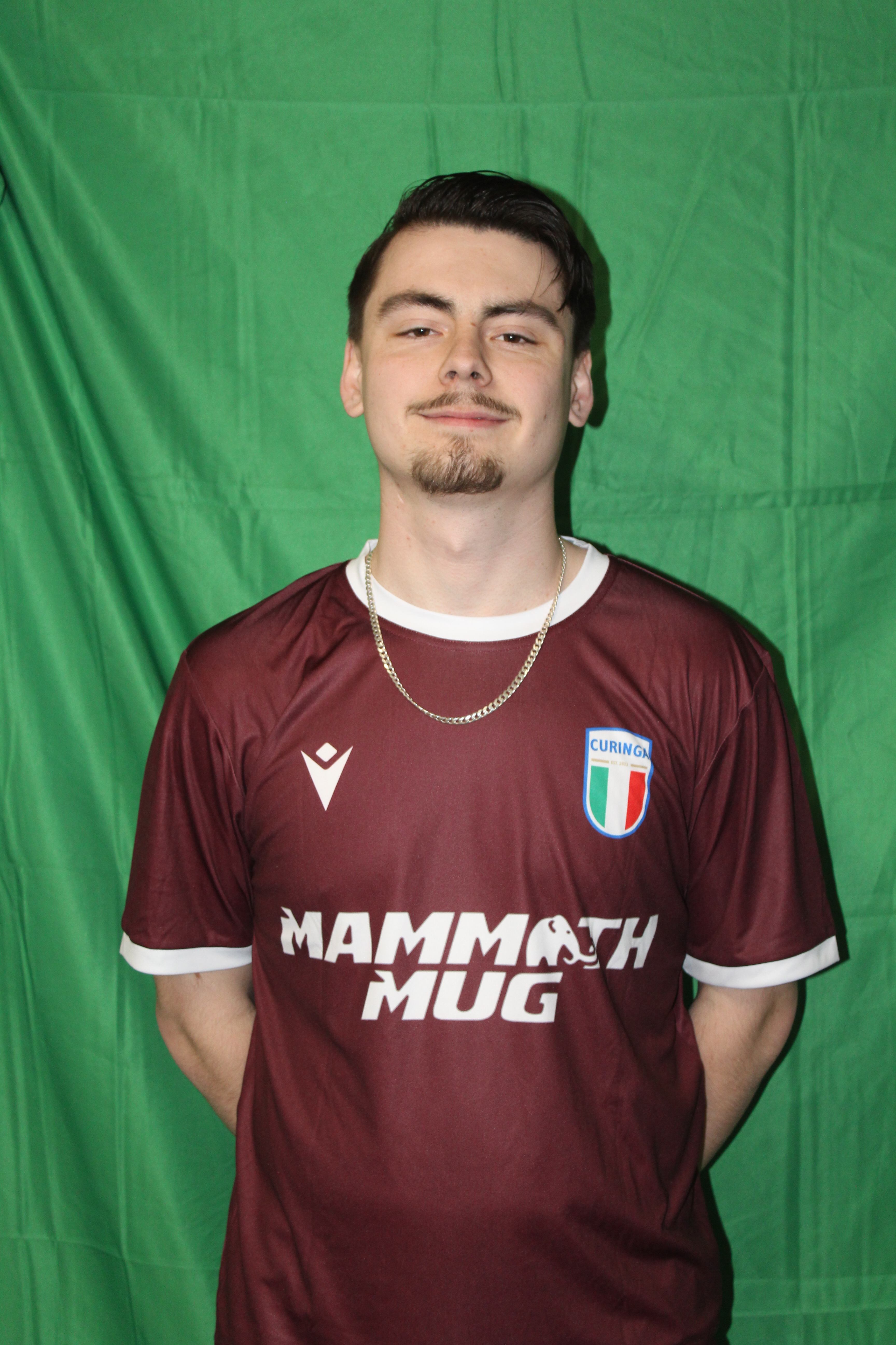 Buringa FC player in maroon jersey with gold chain