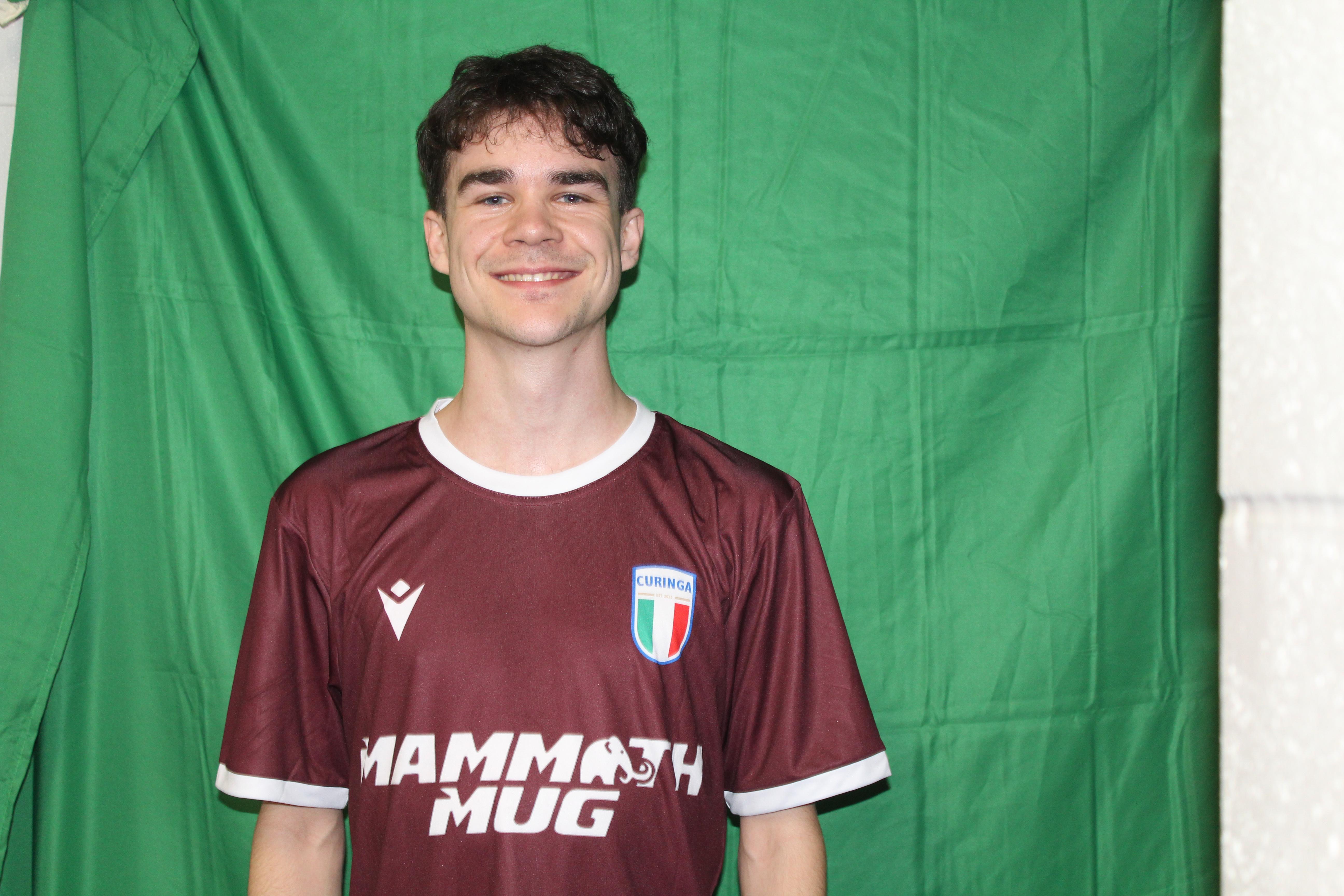 Buringa FC player smiling in team jersey