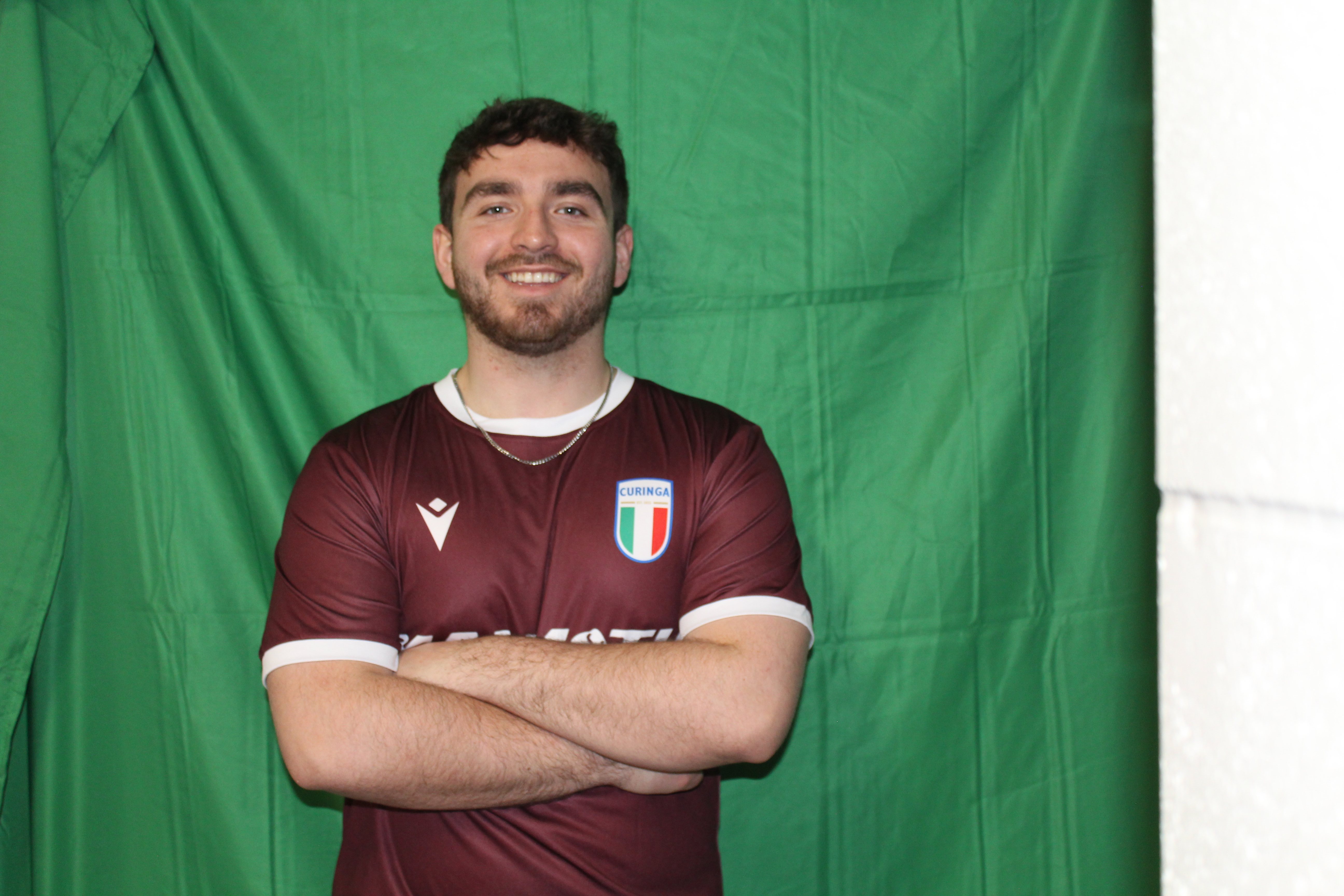 Buringa FC player with beard and arms crossed smiling